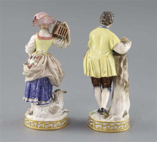 Two Meissen figures of a boy with a bird nest and girl with a bird cage, late 19th century, H. 18cm, minor losses